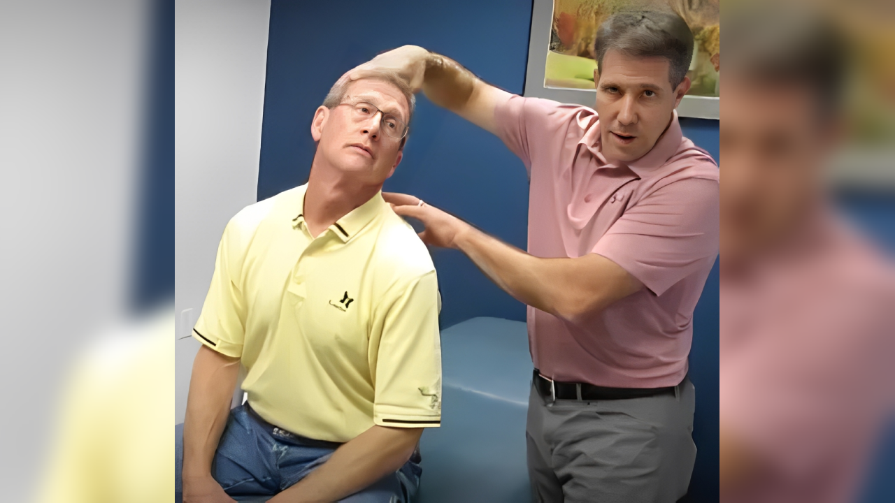 A man is getting his head shaved by another man.